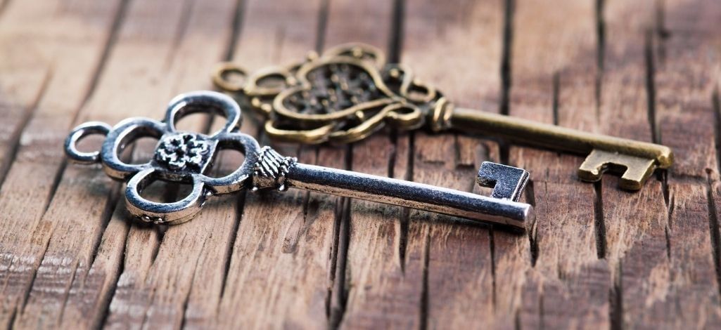 Escape room keys on wooden table
