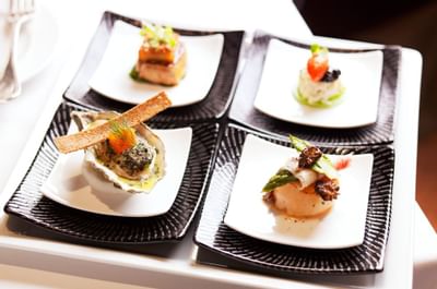 Top shot of 4 dishes served in Gordon Grill at Goodwood Hotel