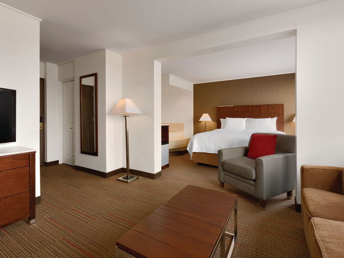 Lounge area and bed in hotel room