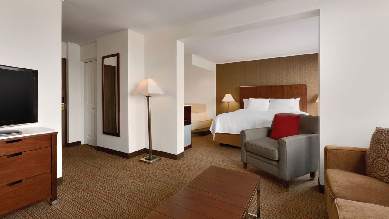 Lounge area and bed in hotel room