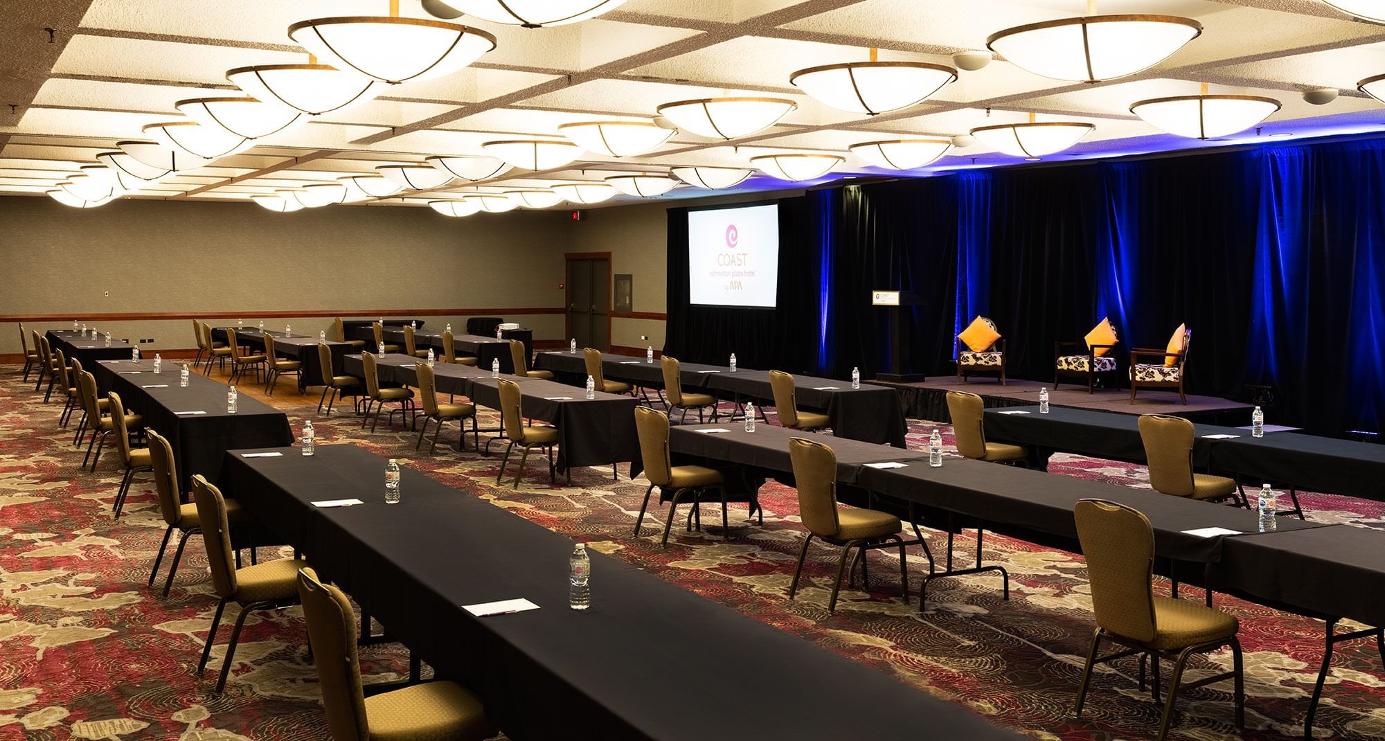 Tables and stage set up for conference/presentation