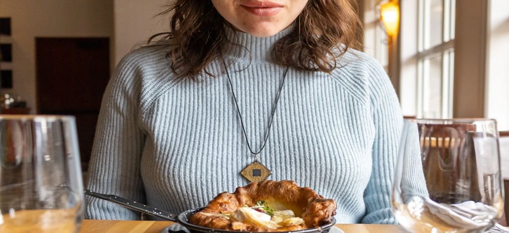 A person enjoys a comforting meal at a Canmore restaurant.