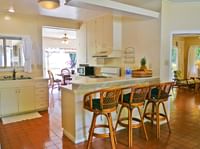 cottage kitchen with bar seating at Waimea Plantation Cottages