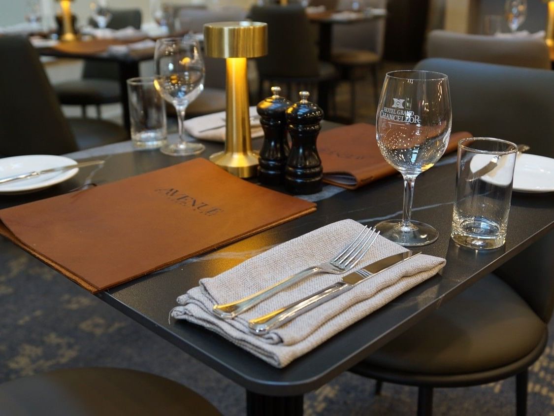 Elegantly set dining table with wine glasses and cutlery at The Avenue Restaurant & Lobby Bar, Hotel Grand Chancellor Launceston.