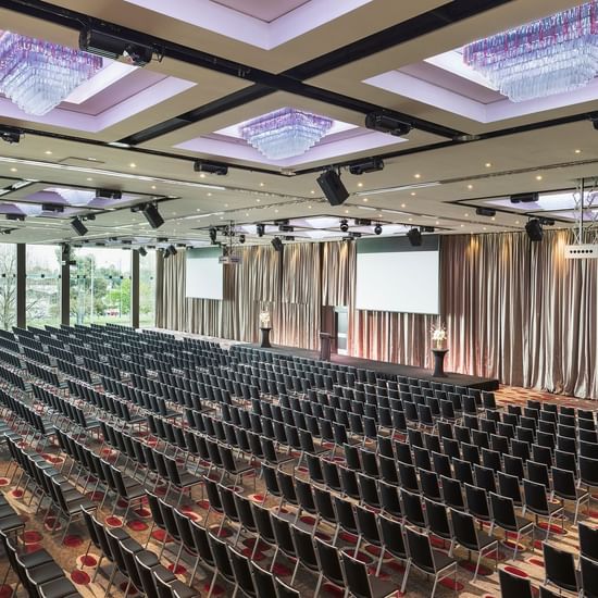 Theatre set-up with project panels in Grand Ballroom with carpeted floors at Pullman Albert Park