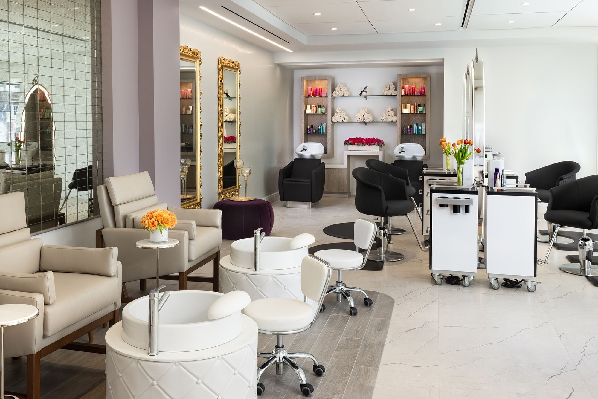Interior of the Salon with seating, pedicure stations, and mirrors at Le Spa by Warwick Melrose
