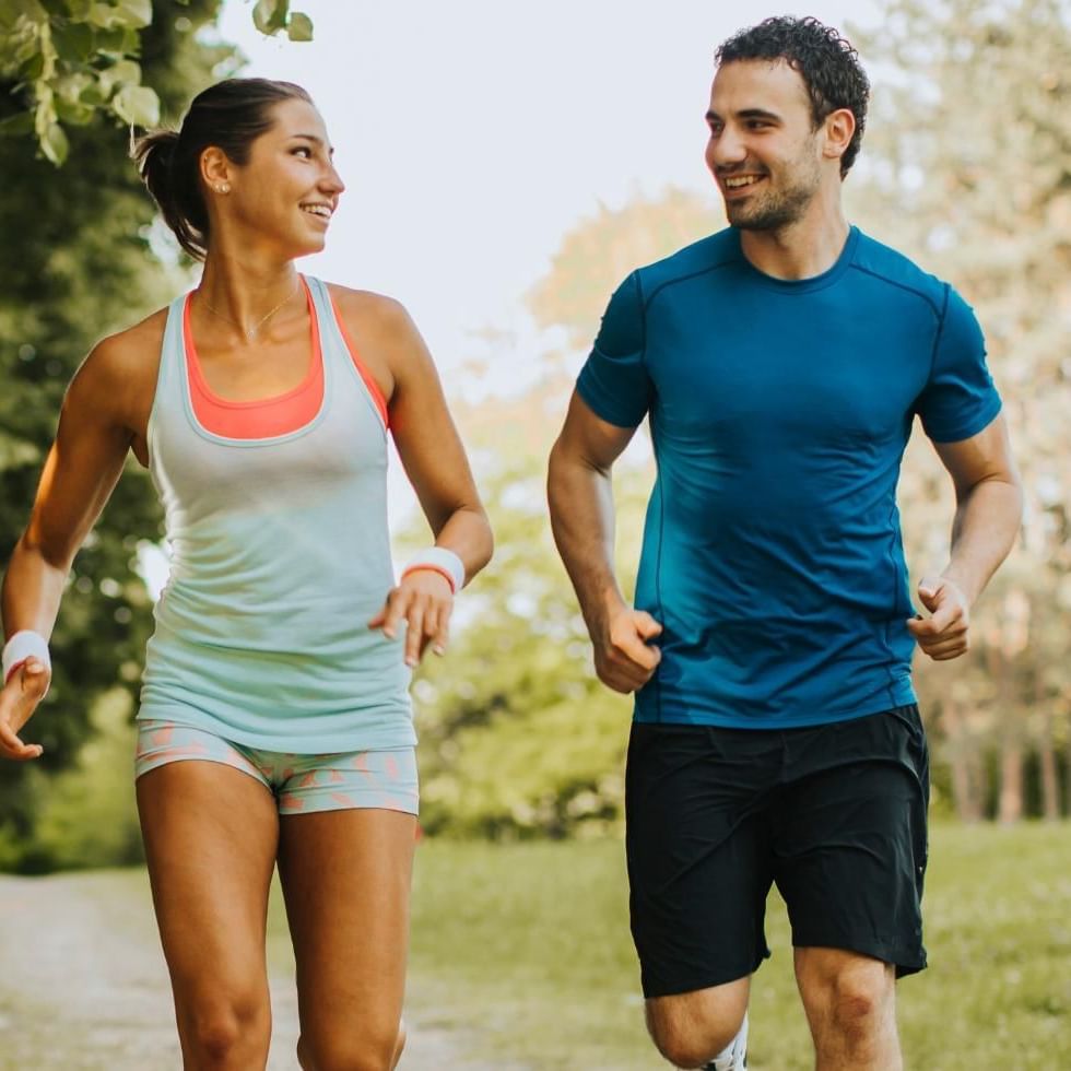 Man and women running together