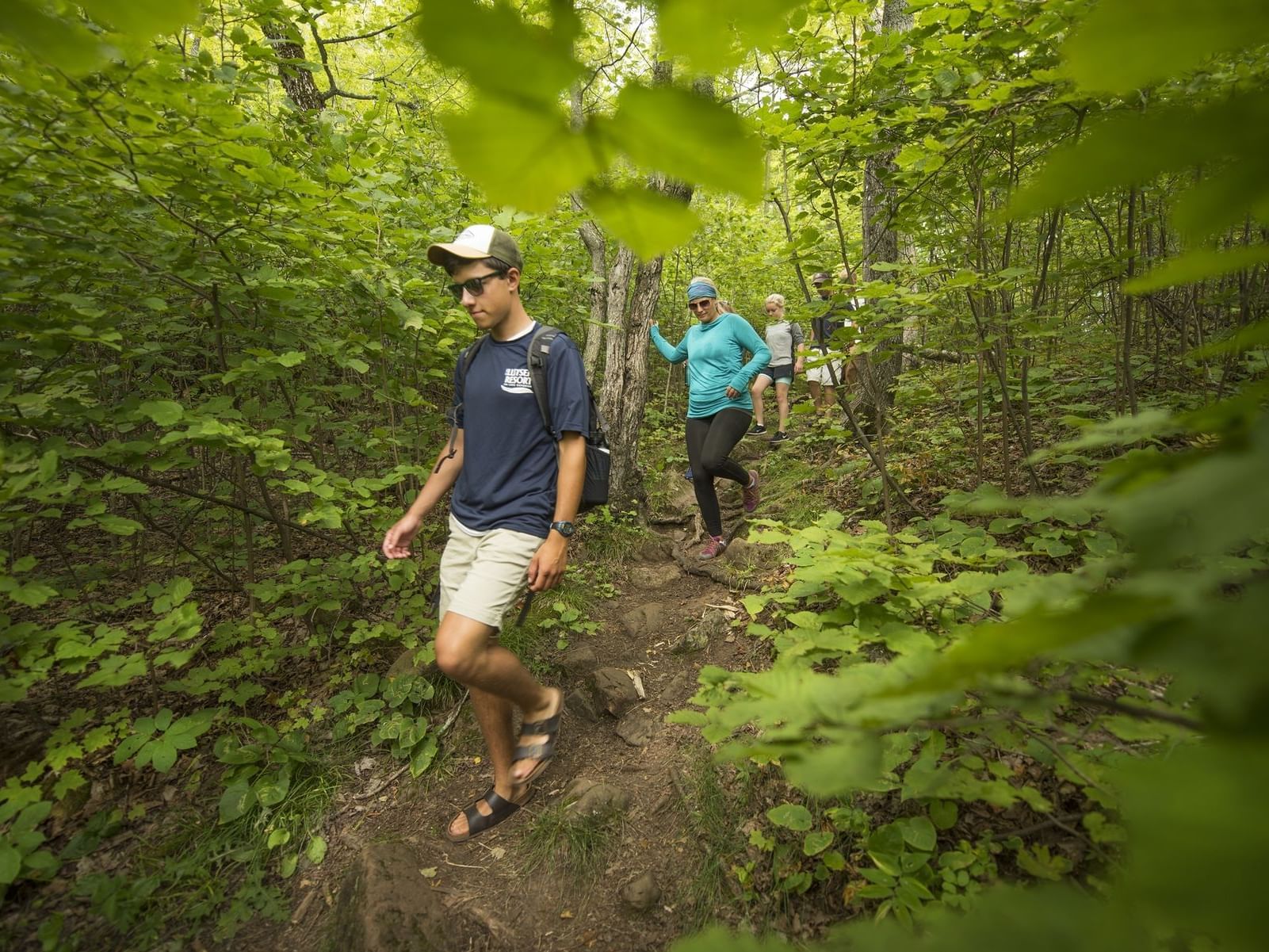 Group of people walking through the woods near Lutsen Resort