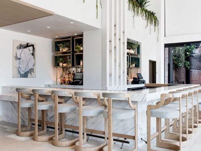Fully white theme chair and Sunrise Cafe at Dream Hollywood
