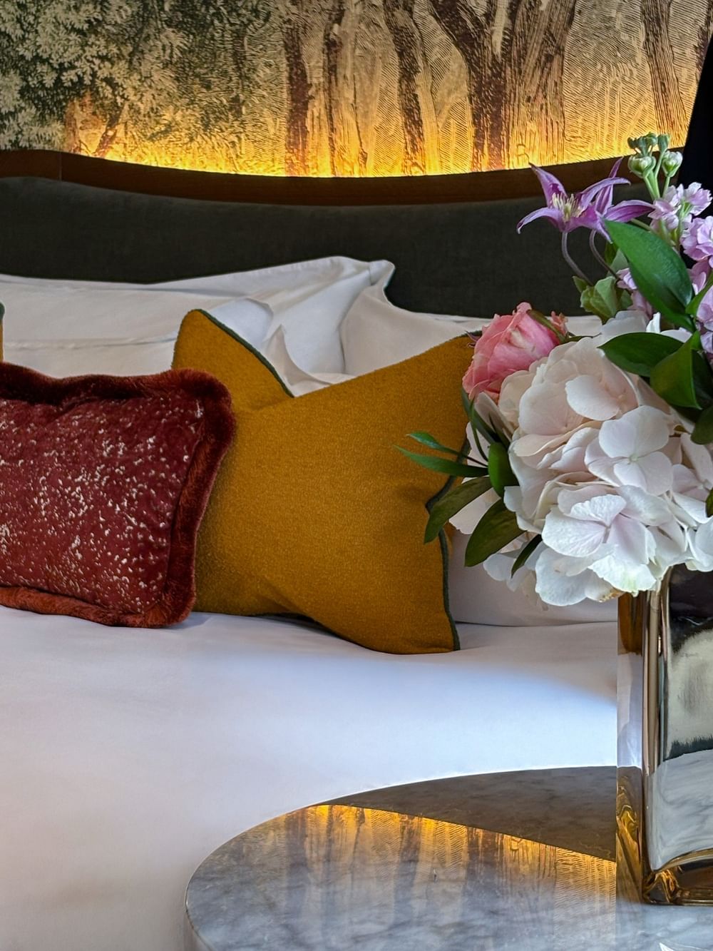 Executive Room with decorative pillows and flowers at The Capital Hotel, Apartments & Townhouse
