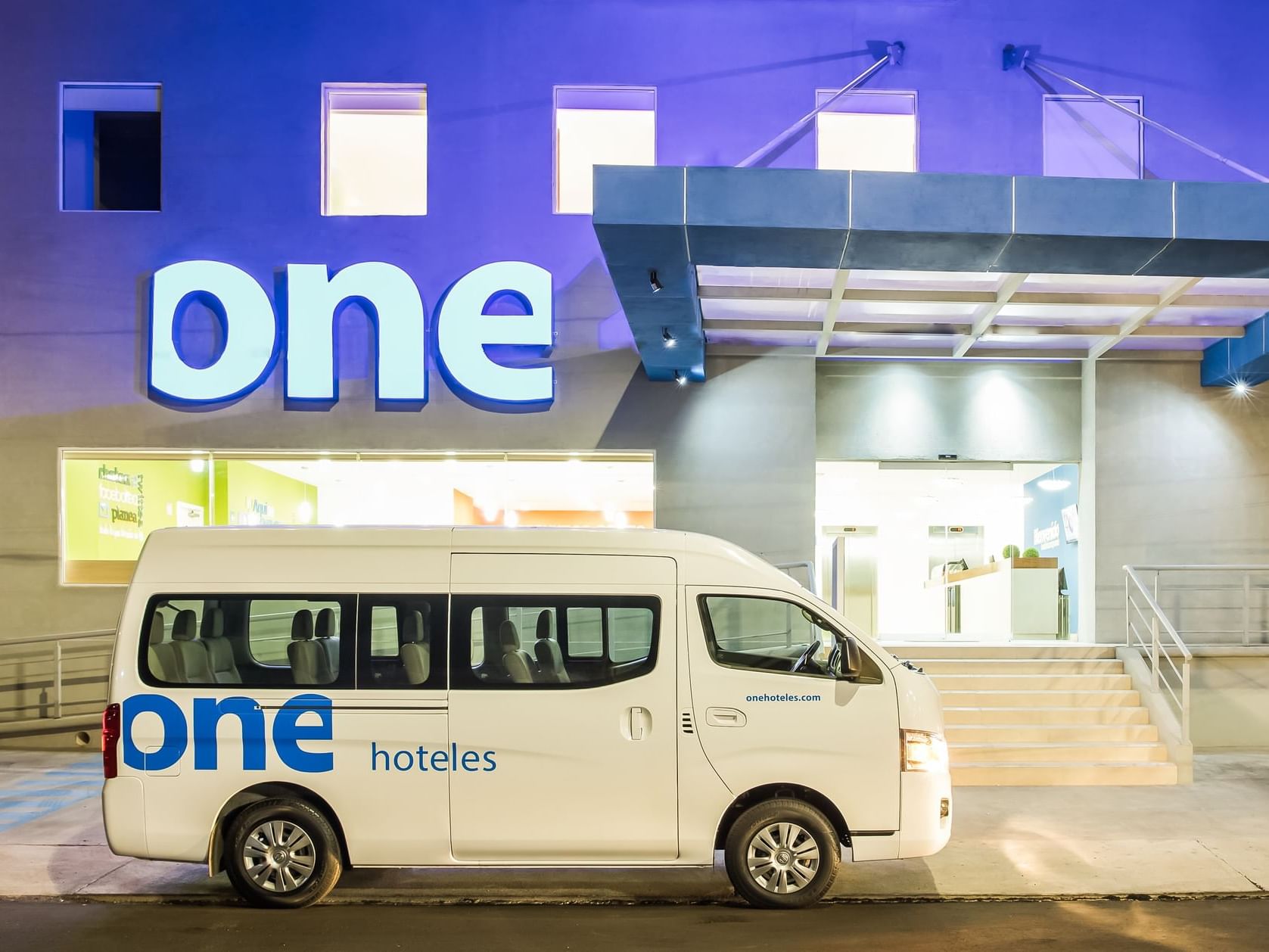 A van from the transport service of One Hotels, at the entrance