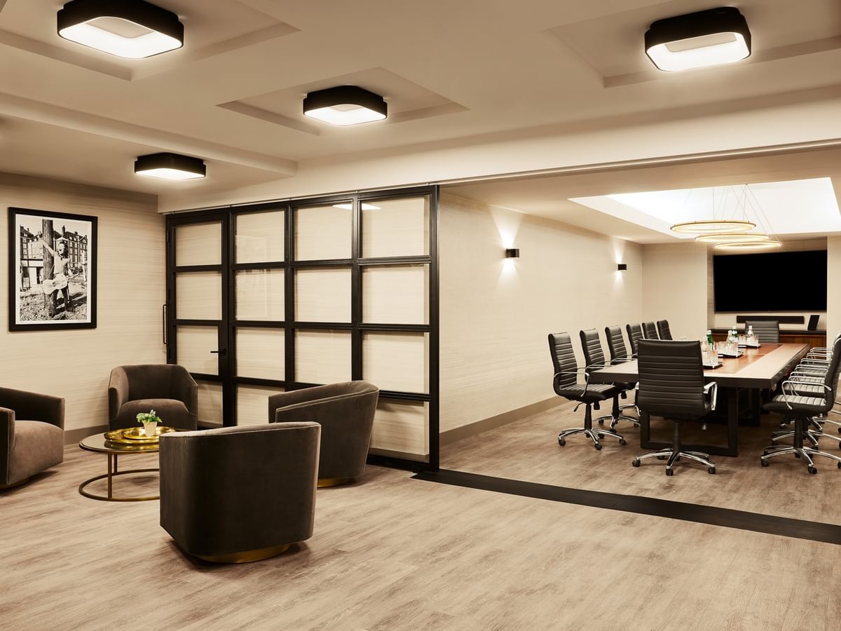Modern Executive Boardroom with conference table, lounge seating, and glass partition at Gansevoort Meatpacking NYC - NEW