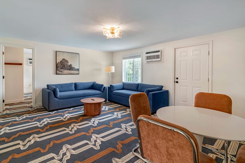 Hotel suite living area with seating at Driftaway Hotel and Pool