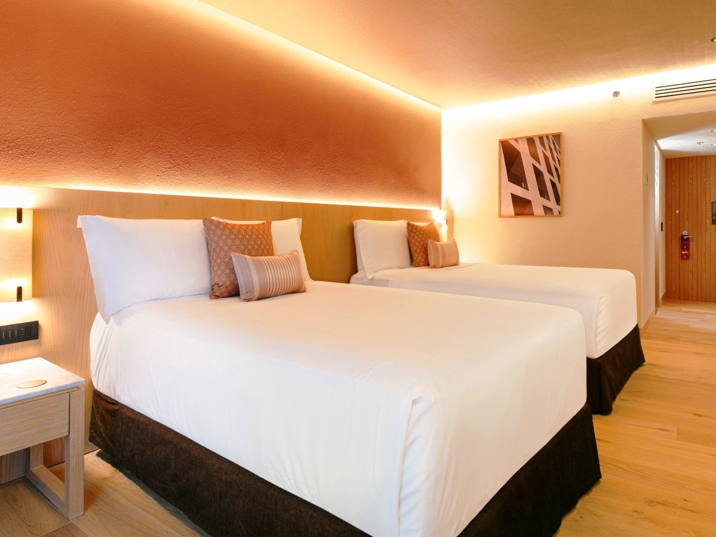 2 Double Deluxe Plus room featuring orange walls and glowing recessed lighting at Camino Real Polanco Mexico