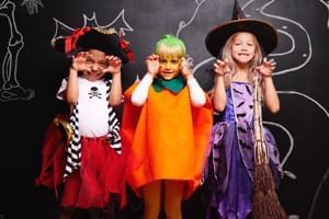 Three children in Halloween costumes at SeaWorld Orlando near Lake Buena Vista Resort Village & Spa