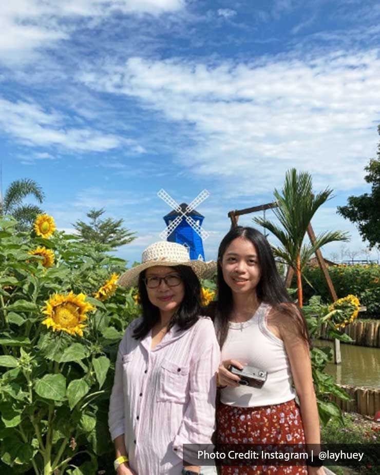 Women were taking a picture with the sunflowers at Sunflower Garden - Lexis Suites Penang