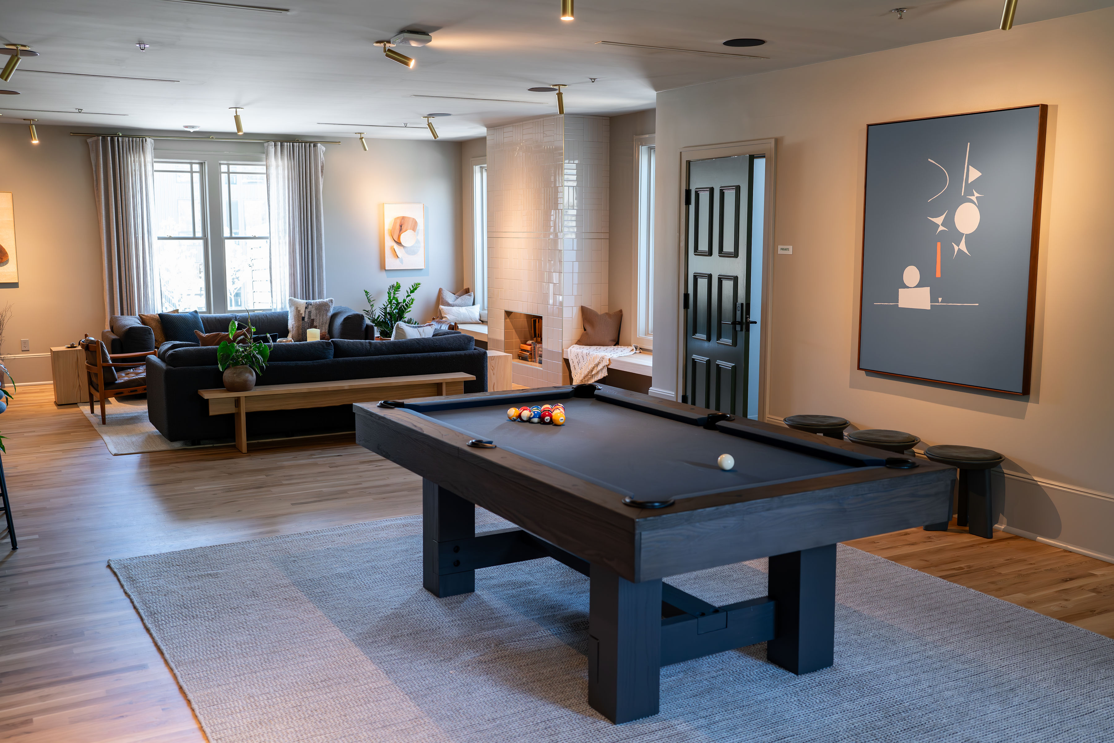 A private club room with a billards table in the center