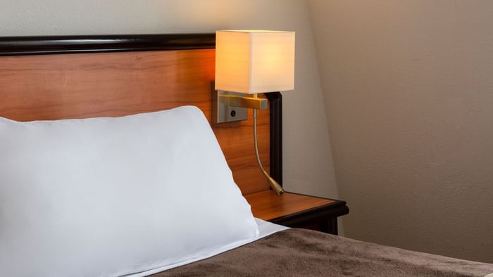 Closeup of a Bedroom with pillows at Hotel Astoria Vatican
