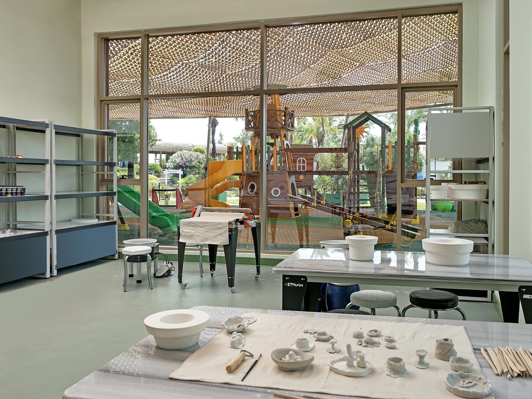 Hand-crafting items on a table in Kikoa Kids Club at Titanic Deluxe Lara