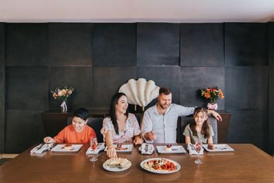 Family enjoying meal served at Hotel Coral y Marina