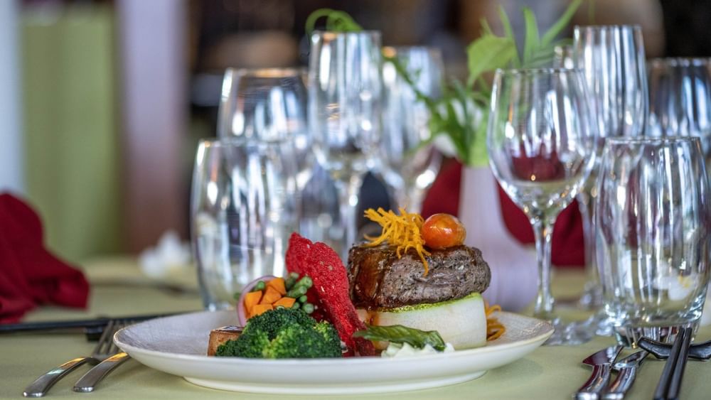 Gourmet steak dinner with steamed vegetables in Wild Ginger Restaurant at warwick le lagon-vanuatu