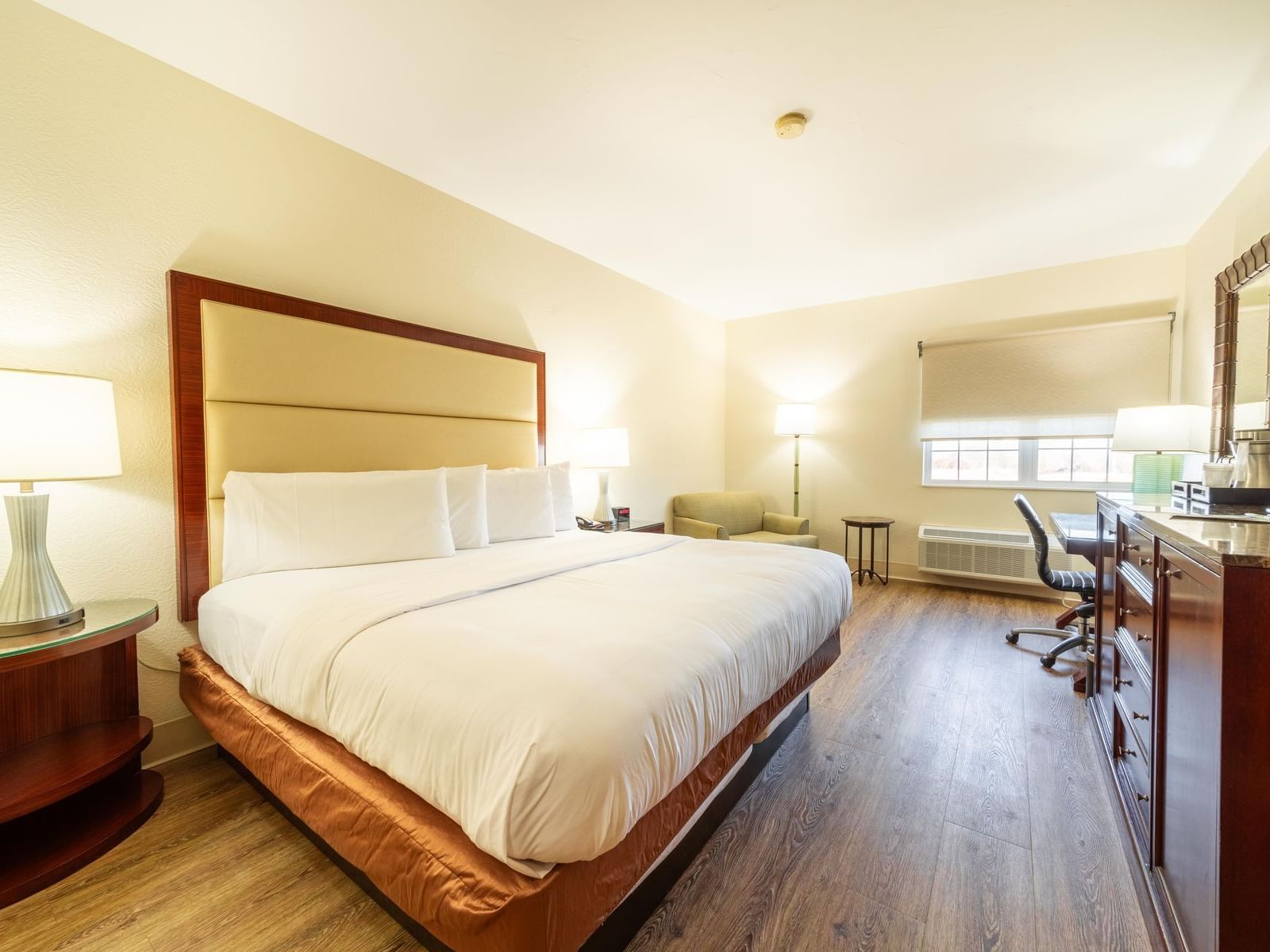 Workspace facing by the bed in Standard Roll In Accessible Room with wooden floors at South Branch Inn Moorefield