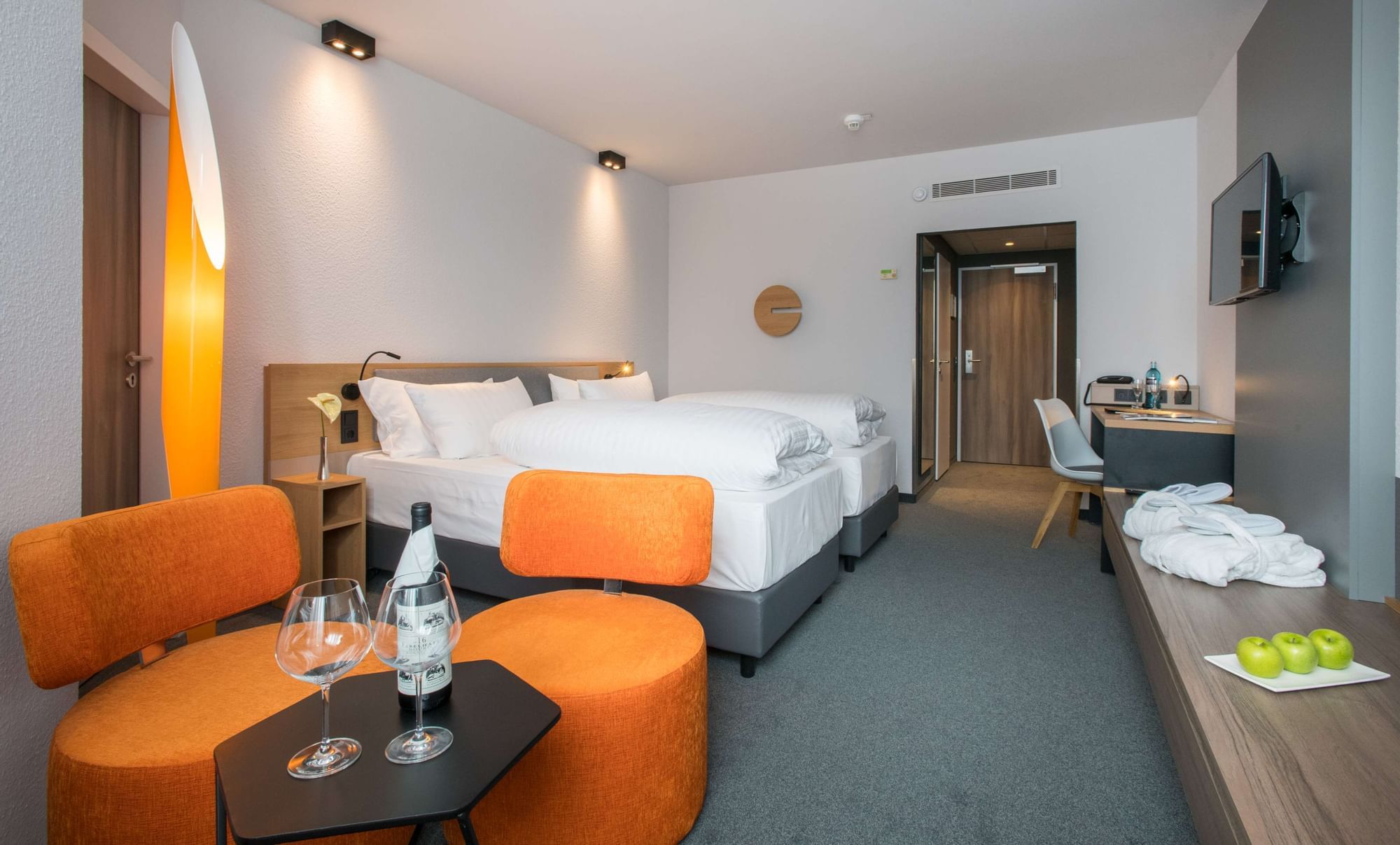 Comfort Room with Wine Bottles & glasses at Flemings Express