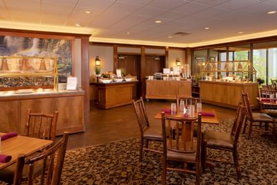 The breakfast buffet area at Lake Placid Club Grandview features wooden furniture and serving stations