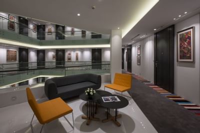 Lounge area by the stairway at Eastin Residences Vadodara