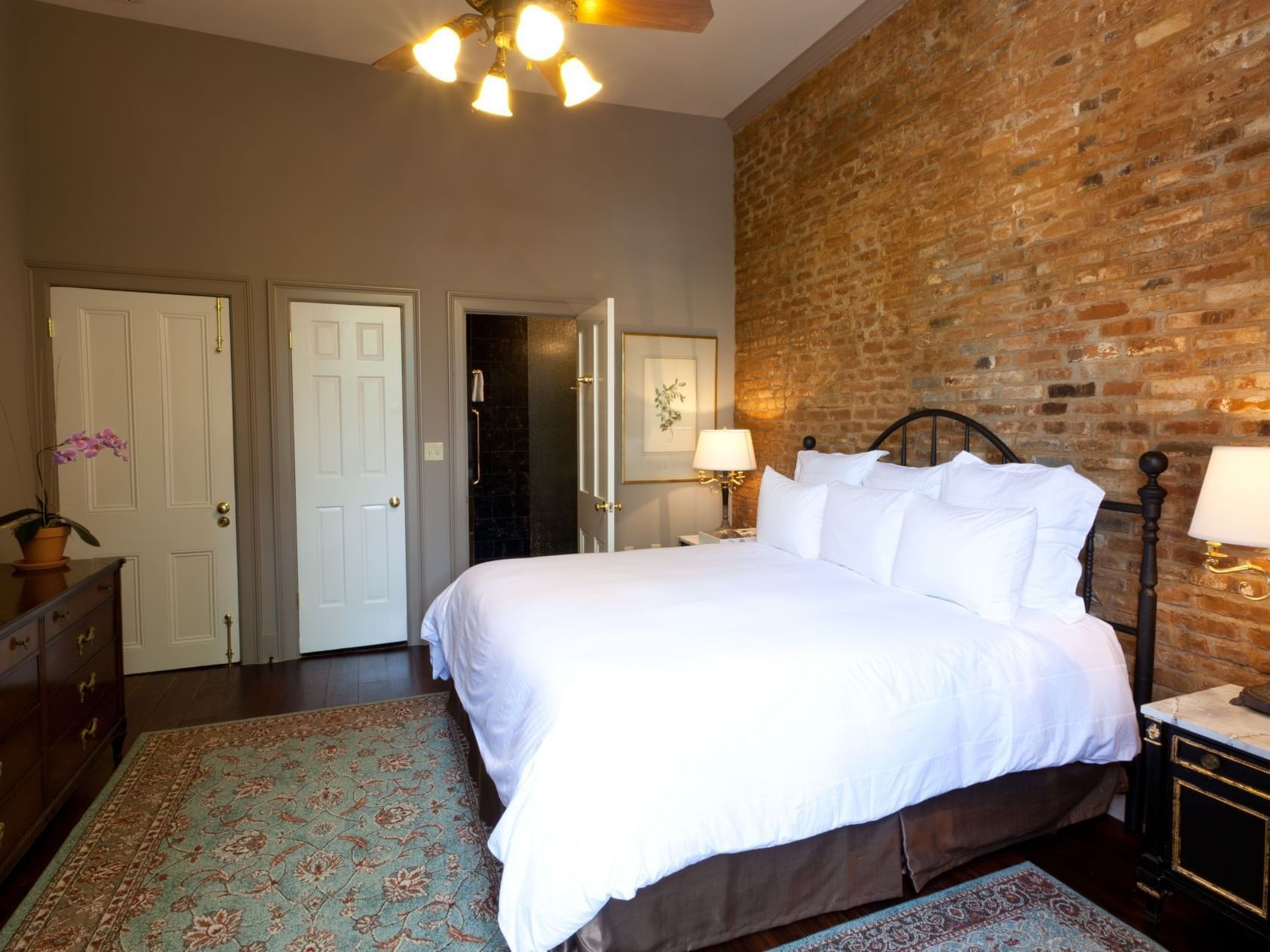 Interior of Audubon Cottage 6 with king bed at Audubon Cottage