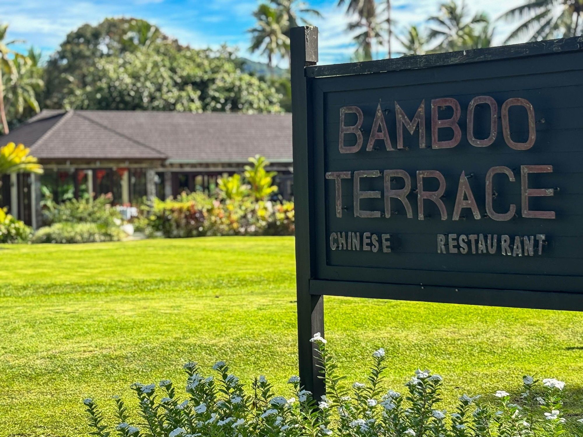 Bamboo Terrace Chinese Restaurant sign in front of lush greenery at The Naviti Resort - Fiji.