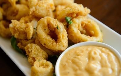 Fried calamari with a dipping sauce in Solé on the Green & Joe\'s Place Bar at Clemson University Conference Center & Inn
