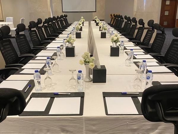 Long conference table in a meeting room at Naviti by Warwick Al Khobar
