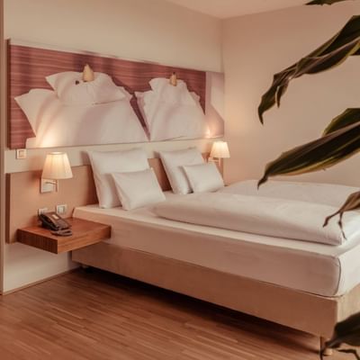 Comfy bed in Balance Suite at Falkensteiner Balance Resort