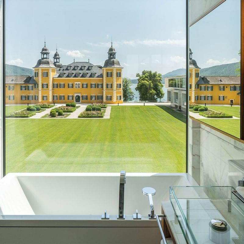 Garden view from a bathroom window at Falkensteiner Hotels