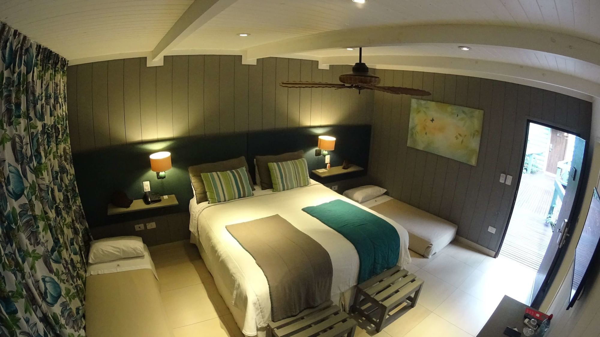 Interior of Family Room bedroom with a queen bed at DOT Hotels