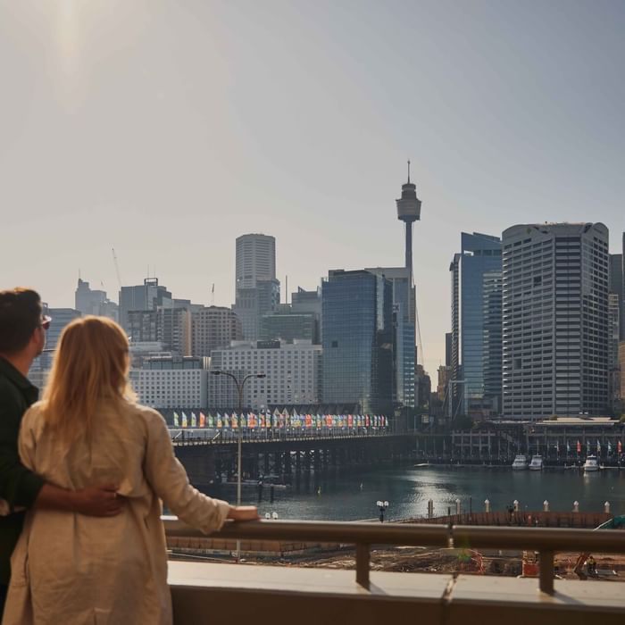 Couple enjoying sunset drinks on ibis bar deck