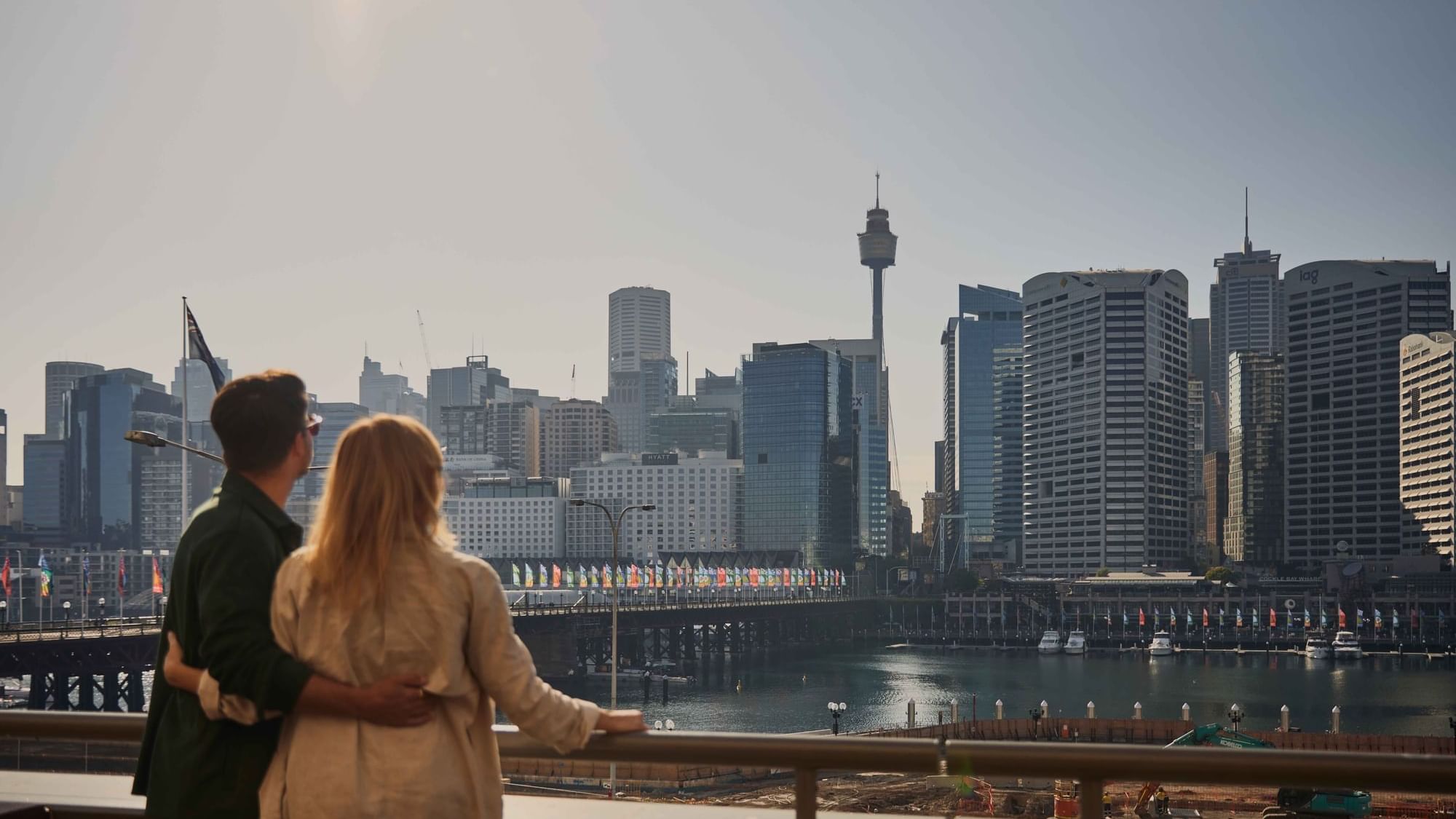 Couple enjoying sunset drinks on ibis bar deck