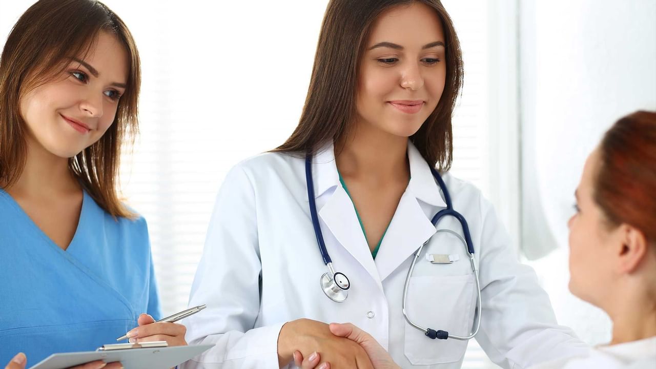 Doctor and nurse with patient