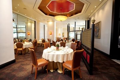 Dining tables arranged in restaurant at Hanoi Daewoo Hotel