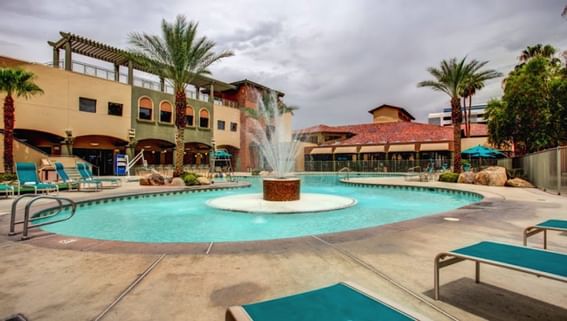 Outdoor Pool surrounded with lounge area at Alexis Park Resort