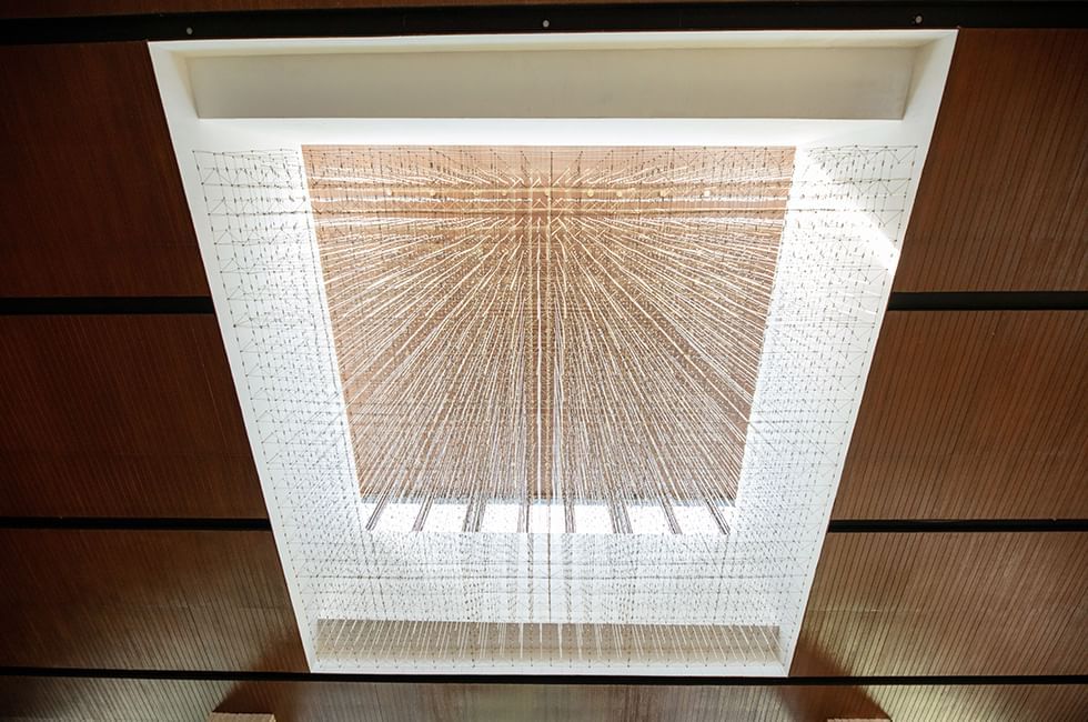 Square light fixture with radiating string lights at Live Aqua Resorts and Residence Club