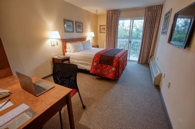 view of the bedroom with the table at Bear Lodge 