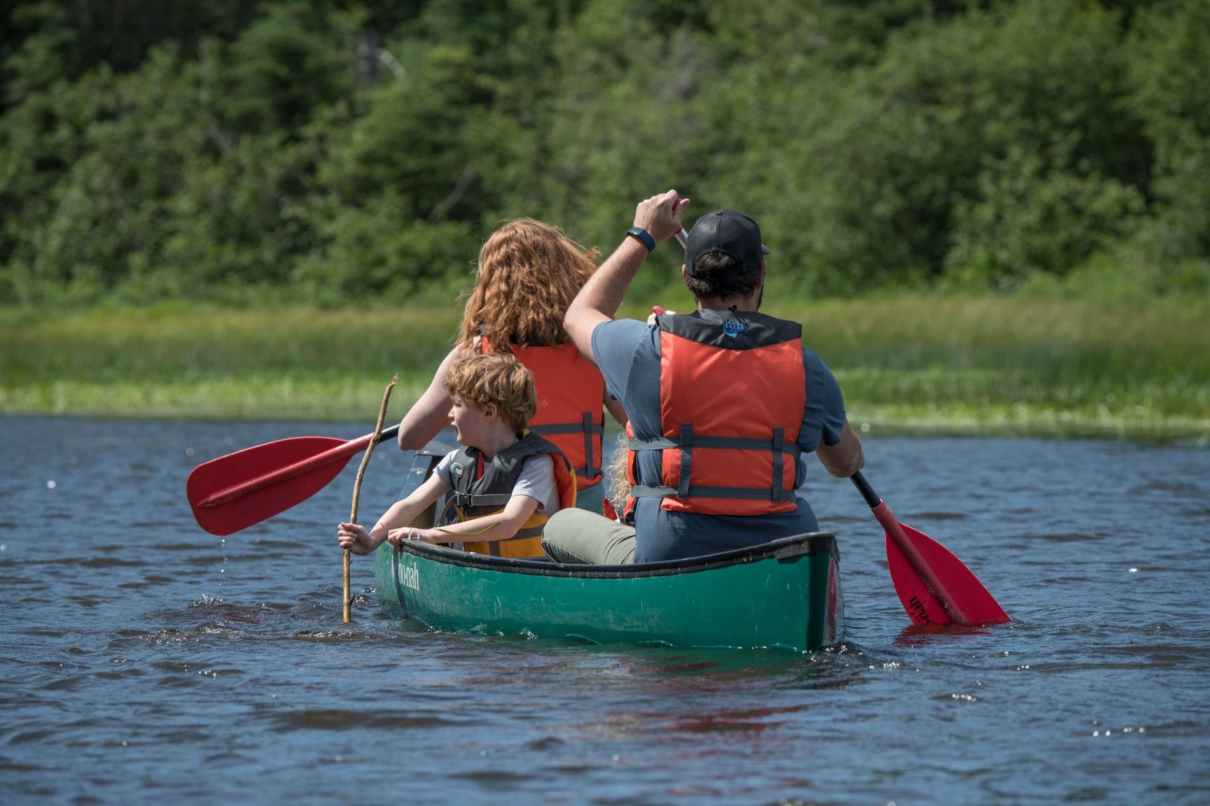 A family kayaking in the Superior Lake near Bluefin Bay