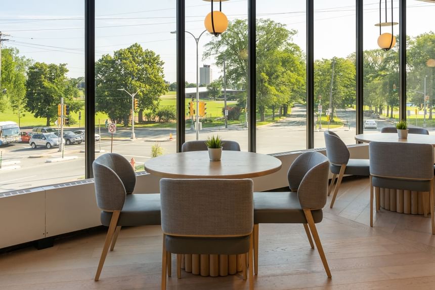 Modern dining area at The Cannery Restaurant at the Atlantica Hotel Halifax with tables and chairs, l