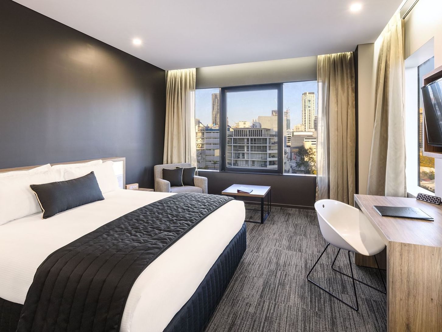 Comfy bed in Executive King Room at Grand Chancellor Brisbane