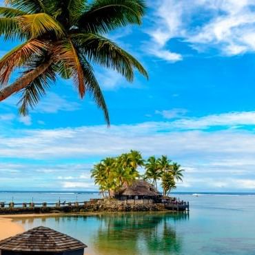 Landscape view of a deck by the beach at Warwick Fiji