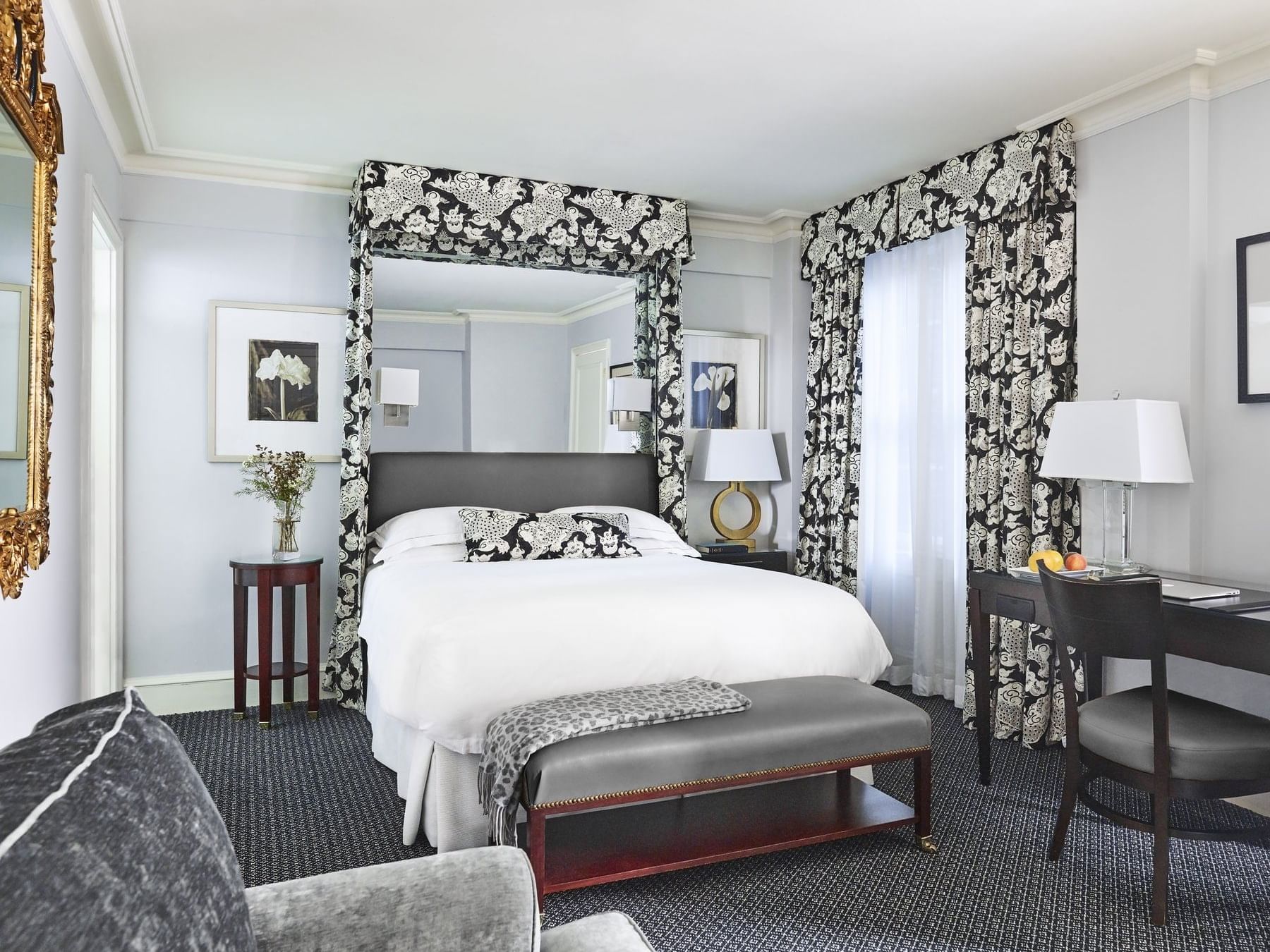 King bed & a work desk in Deluxe Guestroom at Eliot Hotel