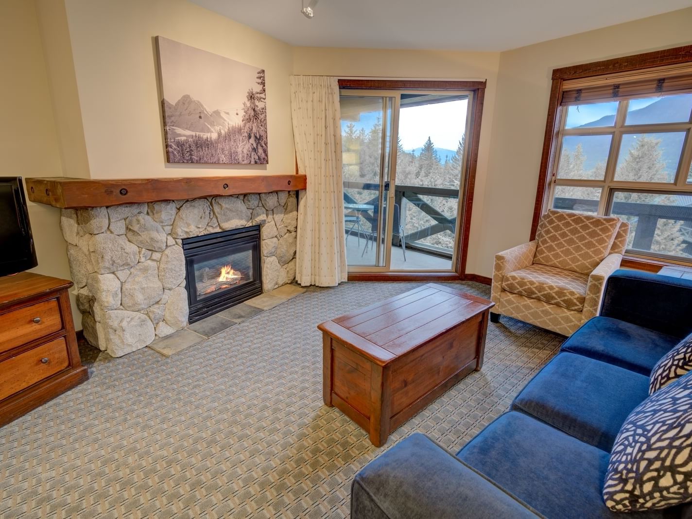 blue couch in living room with fireplace