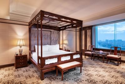 Bed & furniture in Presidential suite at White Swan hotel